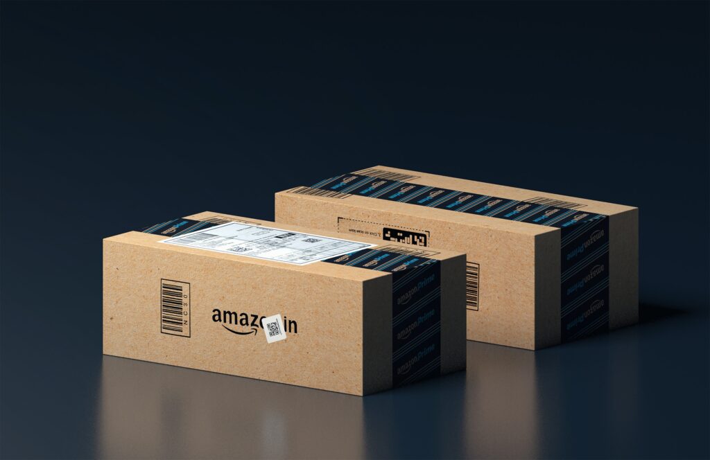 Two Amazon delivery boxes with dark background